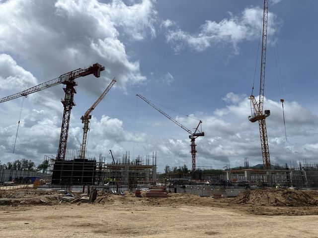 Wide view of the Mai Khao site with four tower cranes over early column works